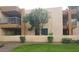 Condo exterior showcasing well-maintained landscaping, balconies, and a serene setting with lush greenery and manicured lawns at 17211 N 35Th Ave, Phoenix, AZ 85053