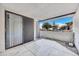 Relaxing outdoor patio with sliding glass doors providing a view of the trees and blue sky at 17211 N 35Th Ave, Phoenix, AZ 85053