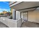 Private patio with a partial privacy wall and sliding glass door entrance at 17211 N 35Th Ave, Phoenix, AZ 85053