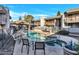 Relaxing community pool area with comfortable seating, umbrellas, and lush landscaping at 17211 N 35Th Ave, Phoenix, AZ 85053