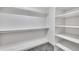 Spacious walk-in closet with built-in shelving and ample storage space, ready for organization at 17211 N 35Th Ave, Phoenix, AZ 85053