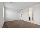 A bedroom featuring carpet floors, a window, and an ensuite bathroom at 1768 W Storia Ave, Apache Junction, AZ 85120