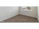 Basic bedroom with plush carpeting and a single window at 1768 W Storia Ave, Apache Junction, AZ 85120