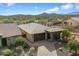 Scenic aerial view of a well-maintained desert home with an attached garage at 17963 E Silver Sage Ln, Rio Verde, AZ 85263