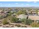 Expansive aerial view of a well-maintained community with mountain views in the distance at 17963 E Silver Sage Ln, Rio Verde, AZ 85263