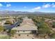 Neighborhood aerial showcasing mountain views, landscaping, and the home's setting at 17963 E Silver Sage Ln, Rio Verde, AZ 85263