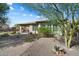 Backyard with desert landscaping and covered patio offering a tranquil outdoor space at 17963 E Silver Sage Ln, Rio Verde, AZ 85263