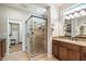 Bathroom showcasing a walk-in glass shower, vanity with granite counters, and a large mirror at 17963 E Silver Sage Ln, Rio Verde, AZ 85263