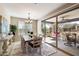 The dining area features a large sliding glass door that opens to the outdoor patio and backyard at 17963 E Silver Sage Ln, Rio Verde, AZ 85263