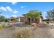 The property features desert landscaping and a paved driveway leading to the garage and covered entryway at 17963 E Silver Sage Ln, Rio Verde, AZ 85263