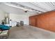 Spacious garage with epoxy floors, built-in storage cabinets, and overhead lighting at 17963 E Silver Sage Ln, Rio Verde, AZ 85263