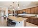 An open-concept kitchen with granite countertops, stainless steel appliances, and a large center island at 17963 E Silver Sage Ln, Rio Verde, AZ 85263