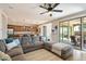 A spacious living area seamlessly connects to the kitchen, offering tile floors and access to the outdoor patio at 17963 E Silver Sage Ln, Rio Verde, AZ 85263