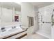 Bright bathroom featuring a shower with grab bars and vanity with sink at 1992 E Shetland Dr, San Tan Valley, AZ 85140