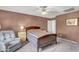 Cozy bedroom featuring soft carpet, a ceiling fan, and neutral paint at 1992 E Shetland Dr, San Tan Valley, AZ 85140