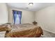 Comfortable bedroom with a window that provides natural light and neutral colored walls at 1992 E Shetland Dr, San Tan Valley, AZ 85140