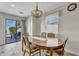 Bright dining area featuring sliding door access to the backyard and an elegant light fixture at 1992 E Shetland Dr, San Tan Valley, AZ 85140