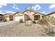 Charming single-story home featuring low-maintenance desert landscaping and an attached two-car garage at 1992 E Shetland Dr, San Tan Valley, AZ 85140