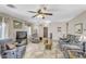 Spacious living room featuring tile floors, a ceiling fan, and neutral paint tones at 1992 E Shetland Dr, San Tan Valley, AZ 85140