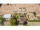 An aerial view of a home showcasing the backyard, patio, fireplace, outdoor kitchen, and pergola at 20785 W Canyon Dr, Buckeye, AZ 85396