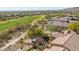 Expansive backyard retreat with golf course views and covered patio is perfect for outdoor living at 20785 W Canyon Dr, Buckeye, AZ 85396