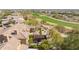 Aerial view of backyard living and golf course featuring homes with green landscaping and local trees at 20785 W Canyon Dr, Buckeye, AZ 85396