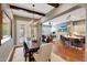 Open-concept dining room with wood floors, exposed beam accents and a chandelier at 20785 W Canyon Dr, Buckeye, AZ 85396