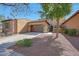 Attractive home with a two-car garage, desert landscaping, and a welcoming entrance at 20785 W Canyon Dr, Buckeye, AZ 85396