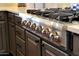 Close-up of a high-end Thor kitchen stove, showcasing its precise temperature control and stainless steel construction at 20785 W Canyon Dr, Buckeye, AZ 85396