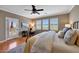 Comfortable bedroom featuring hardwood floors, and white shutters, creating a relaxing atmosphere at 20785 W Canyon Dr, Buckeye, AZ 85396