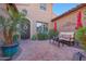 Inviting outdoor patio space featuring stylish furniture, colorful umbrellas, and lush greenery at 20785 W Canyon Dr, Buckeye, AZ 85396