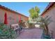 Serene patio space offering comfortable seating, shade umbrellas, and a tranquil garden setting at 20785 W Canyon Dr, Buckeye, AZ 85396