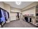 Spacious walk-in closet with ample shelving, hanging rods, and a full-length mirror at 20785 W Canyon Dr, Buckeye, AZ 85396