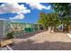 Large backyard with a greenhouse, patio area and low-maintenance landscaping at 238 N 62Nd St, Mesa, AZ 85205