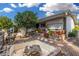 Enchanting backyard featuring unique landscape details, hardscape and mature trees at 238 N 62Nd St, Mesa, AZ 85205