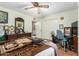 Cozy bedroom showcasing a dresser with a mirror and a closet at 238 N 62Nd St, Mesa, AZ 85205