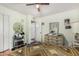 Bedroom showcasing hardwood floors and access to an ensuite bathroom at 238 N 62Nd St, Mesa, AZ 85205