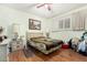 Bedroom with light green walls, hardwood floors, and an area rug at 238 N 62Nd St, Mesa, AZ 85205