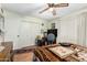 Bedroom featuring a ceiling fan and a window with shutter-style blinds at 238 N 62Nd St, Mesa, AZ 85205