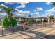 View of a charming single-story house with a well-kept yard, desert landscaping, and a covered carport at 238 N 62Nd St, Mesa, AZ 85205