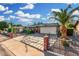 Single-story home with stone accents, a well-manicured front yard, and covered carport, offering curb appeal at 238 N 62Nd St, Mesa, AZ 85205