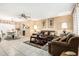 Spacious living area featuring tiled flooring, comfortable seating, and an adjacent dining area at 238 N 62Nd St, Mesa, AZ 85205