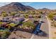 Wide aerial view of a Southwestern neighborhood near a hillside at 25609 N 54Th Ln, Phoenix, AZ 85083