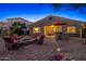 Relaxing backyard with brick patio, comfortable seating, and an outdoor bar at 25609 N 54Th Ln, Phoenix, AZ 85083