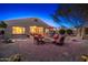 Inviting backyard with a brick patio, fire pit, outdoor bar, and lounge area at 25609 N 54Th Ln, Phoenix, AZ 85083