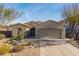 Charming desert home with gravel landscaping, cactus and a two car garage at 25609 N 54Th Ln, Phoenix, AZ 85083