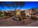 Charming home showcasing desert landscaping, a mature tree, and a neutral palette at 25609 N 54Th Ln, Phoenix, AZ 85083