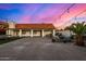 Expansive backyard featuring a tiled roof house, outdoor seating, a grill, and a lush palm tree at 2646 N Robin Ln, Mesa, AZ 85213