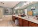 Well-lit bathroom features dual sinks, a vanity, a shower and a soaking tub at 2646 N Robin Ln, Mesa, AZ 85213