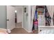 View of a Bedroom Closet with hanging clothes and an open doorway to another room at 2646 N Robin Ln, Mesa, AZ 85213